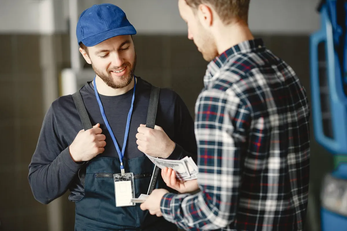 Tradesperson getting paid by a customer right after finishing the job